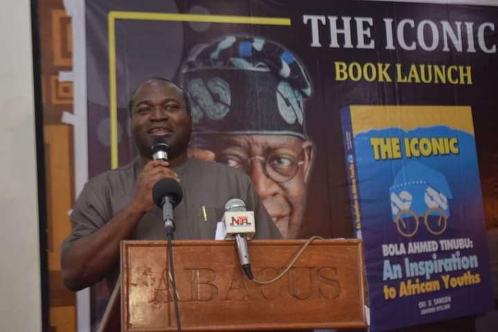Dr. Ayo Ogunsan displaying a book in honour of President Bola Ahmed Tinubu titled: "The Iconic Bola Ahmed Tinubu: An Inspiration To African Youths" during the launch in Lagos. 