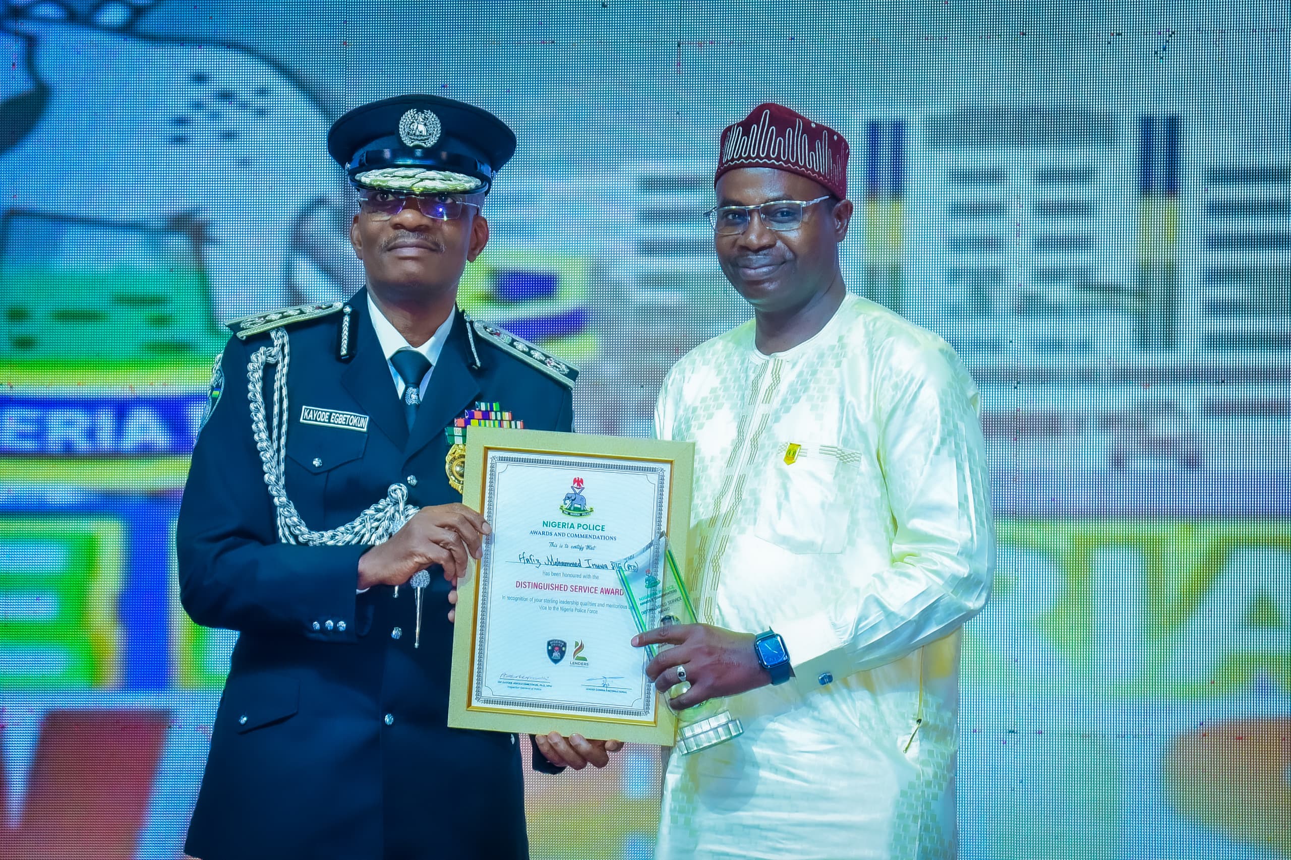 Inspector General of Police, IGP Kayode Egbetokun presenting an award to awardee at the inaugural Nigeria Police Awards and Commendation Ceremony held at the Congress Hall, Transcorp Hilton, Abuja. 
