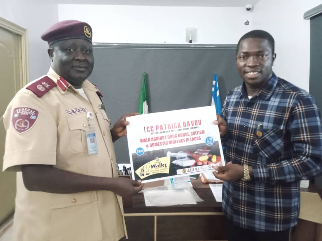 L-R: Sector Commander, FRSC Lagos Sector Command, CC Patrick Davou Dung receiving NAOSNP Walks' Advocacy Material from the President, National Association of Online Security News Publishers, NAOSNP, Comrade Oki Samson