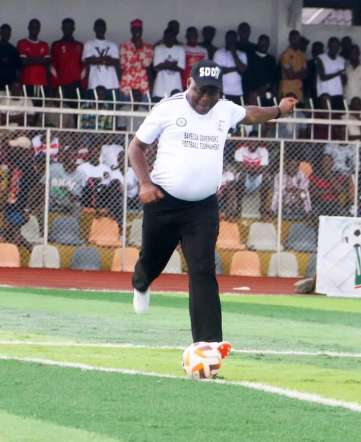 Executive Governor, Bayelsa State, Senator Douye Diri playing a football to flag-off the Prosperity Cup in Yenagoa