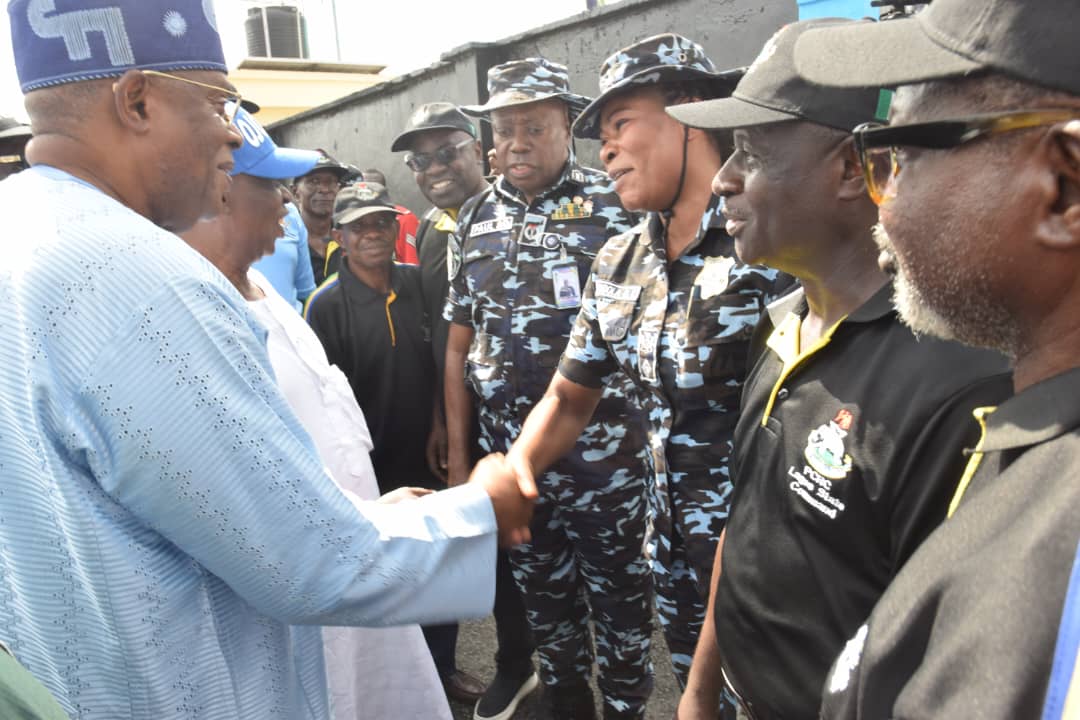 Honourable James Abiodun Faleke in a warm handshake with the DPO, Ojodu Division, CSP Elizabeth Oluwatoyin Opadola during the Commissioning of PCRC Building, Ambulance Bus Station, other Projects facilitated by Hon. James Faleke at Ojodu Police Division 