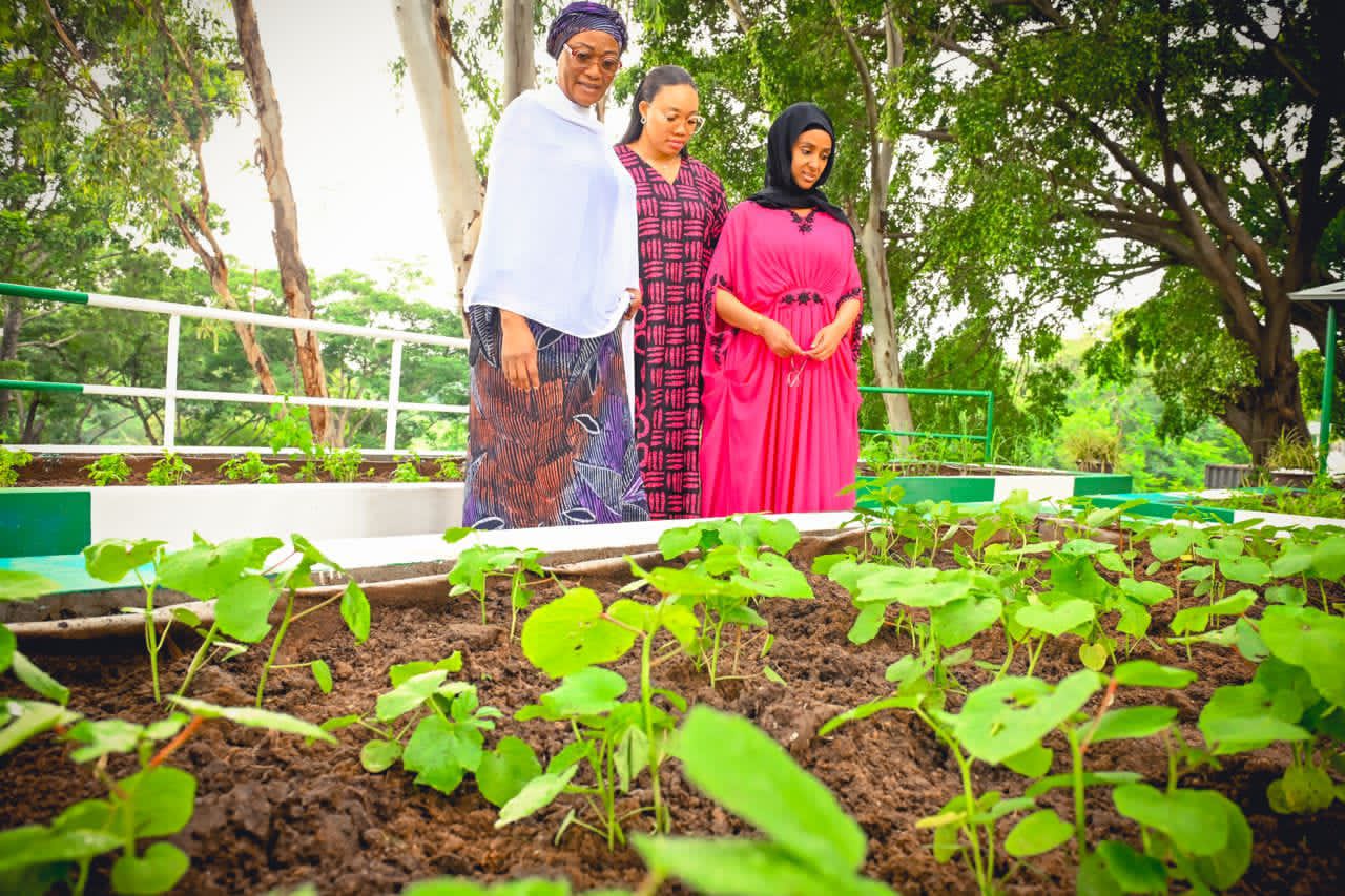 First Lady of the Federal Republic of Nigeria  Senator Oluremi Tinubu; Wife of the Imo State Governor, Barr. Chioma Uzodinma and the Wife of the Minister of State for Defence, Mrs Aisha Mattawale admiring the garden of the First Lady which she planted to encourage women join in the #Every Home A Garden Competition