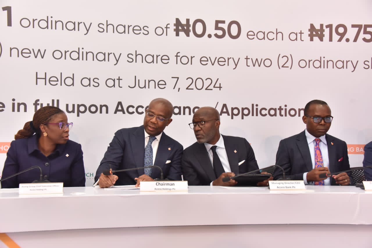 Bolaji Agbede, Acting Group Managing Director, Access Holdings Plc; Aigboje Aig-Imoukhuede, Chairman, Access Holdings Plc; Roosevelt Ogbonna, Managing Director/Chief Executive Officer, Access Bank Plc, and Sunday Ekwochi, Company Secretary, Access Holdings Plc, at the Signing Ceremony for Access Holdings’ Rights Issue of 17,772,612,881 ordinary shares of N0.50 each at N19.75 per share, held at Access Tower in Victoria Island, Lagos…yesterday.