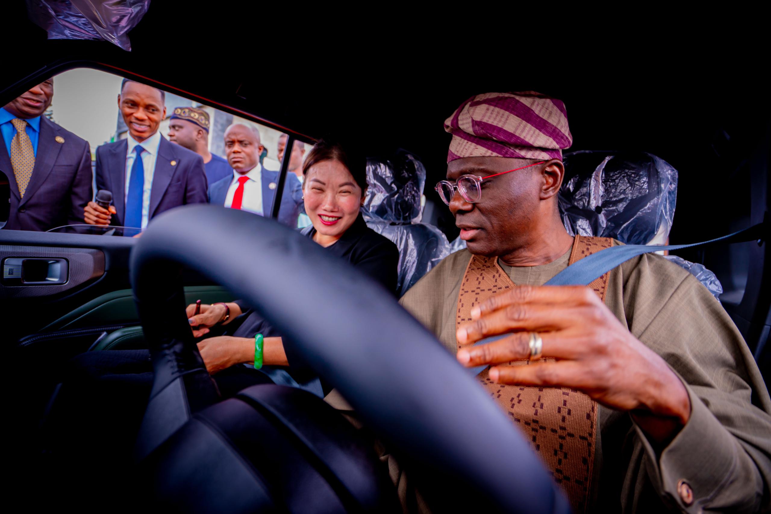 Governor of Lagos State, Mr. Babajide Sanwo-Olu (right) testing driving one of the CIG motor with Chairman of CIG Group, Chief Diana Chen during the official signing of new Lagride partnership with CIG Motors, at the Lagos House, Ikeja, on Monday, 15 July 2024.