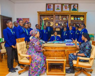 (Seated) Miss Ehi Linus; DSP Mariam Damilola Yusuf, Minister of State for Police Affairs, Hajia Imaan SulaimanIbrahim; other students from the Police Day Secondary School, Area 11, during the recent International Day of the Girl Child celebration, hosted by the Minister of State at the Ministry'sheadquarters in Abuja.