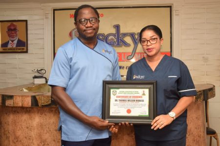 Former Presidential Aspirant and Chief Medical Director of Sckye Hospitals Ltd, Dr. Thomas-Wilson Ikubese and his Wife, Dr. Mrs. Abiola Ikubese during the presentation of NAOSNP Certificate of Credence to Dr. Thomas-Wilson Ikubese at the Sckye Hospitals, Akure, Ondo state.
