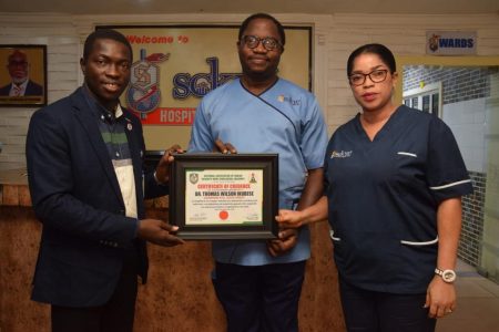 L-R: President, National Association of Online Security News Publishers, NAOSNP, Comrade Oki O. Samson; Former Presidential Aspirant and Medical Director of Sckye Hospitals Ltd, Dr. Thomas-Wilson Ikubese and his Wife, Mrs. Abiola Ikubese during the presentation of NAOSNP Certificate of Credence to Dr. Thomas-Wilson Ikubese at the Sckye Hospitals, Akure, Ondo state. 